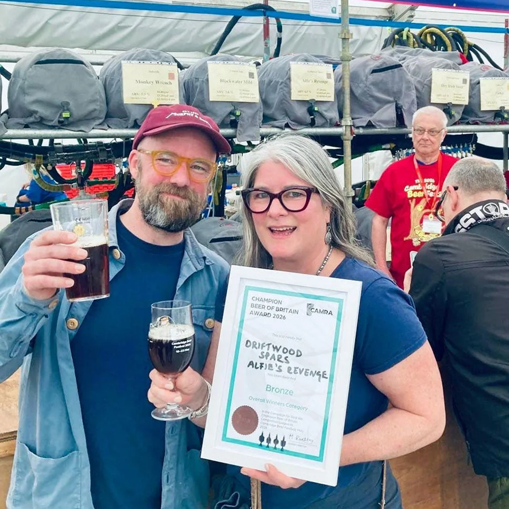 Tim and Lou holding Alfie's Revenge Award Certificate 